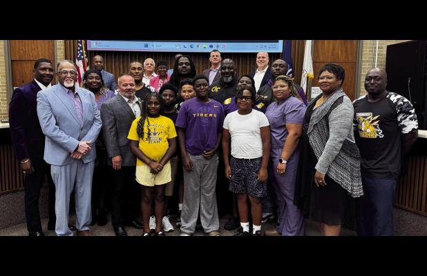 Pictured above are members and players with the Gramercy Tigers youth football program. The Tiger organization will also receive funding from St. James Parish to purchase necessary equipment. The Cooperative Endeavor Agreement also requires the Tigers to 