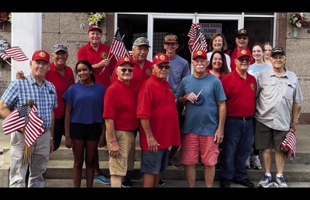 Members of the American Legion, Post 171, along with family members and volunteers, take a break from placing American Flags at the gravesites of deceased Veterans buried in our local cemetaries. The group visited St. Joseph, St. Michael, St. Mary and Ant