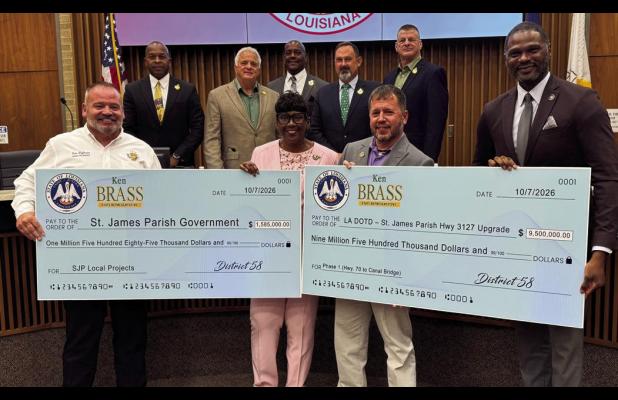 State Representative Ken Brass brought two big checks to the St. James Parish Council last week. One check for $1,585,000 included $1 million for the parish-wide road rehabilitation project planning and construction, $500,000 for the planning and construc