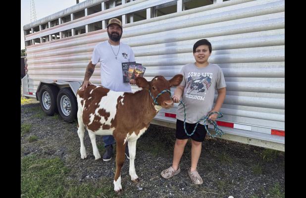 Tad Cavalier and his son Ethan share many special moments together on ET Ranch in Vacherie. Tad holds the three books he wrote. Two books appeal to adults and the third and newest is a wonderful children’s book. If you enjoy books about family, faith an
