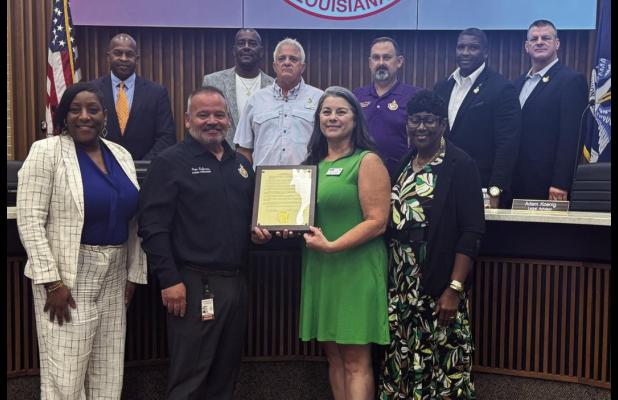Dr. Sarina Lirette, Director of Adult Education at River Parishes Community College, accepts a Resolution from the St. James Parish Council proclaiming September as National Adult Education and Family Literacy Month.