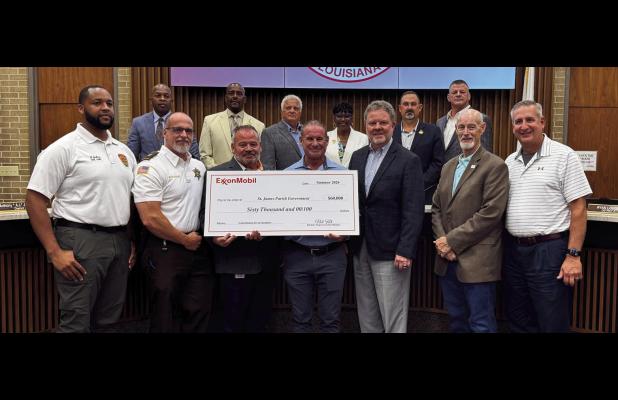 ExxonMobil representative Michael Smith and other company officials presented a $66,000 check to the St. James Parish Council last week representing the cost of hand-held carbon dioxide monitors to be used by the St. James Parish Sheriff's Office. The mon