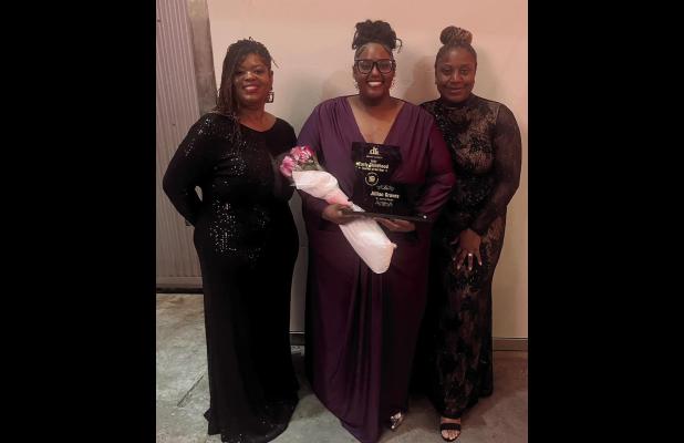 Jillian Graves (center) shows off her Louisiana Early Childhood Teacher of the Year award. Graves is the first St. James Parish Head Start teacher to win the honor.