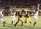 Wildcat senior defensive lineman DeAndré Keller (#72) and another Wildcat defender apply pressure on the Brusly quarterback during last Friday’s 33-13 quarterfinal playoff win. St. James is now a perfect 12-0 and are one win away from playing for the C
