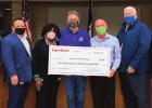 ExxonMobil’s Mike Smith (center) presents a $2,500 check to Sean O’Connor (green mask), President of the North Vacherie Volunteer Fire Department, as part of Exxon’s Good Neighbor grant program. Exxon employees nominate those in the community who gi Parish Council In The Process Of Amending Ordinance Governing Subdivisions