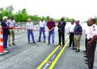 Last March, Bayou Chevreuil Task Force member Ed Becnel (far left) shares a few words before the group cuts the ribbon to open the new Bayou Chevreuil Bridge. Becnel said the Task Force, LDOTD, St. James Parish Government, State Representative Ken Brass a