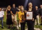 Dr. Roland Waguespack, pictured above with his family and his plaque, was inducted into the St. James High School Hall of Fame.
