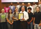 Members of the St. James 4-H Junior Club stand as the parish council proclaims Oct. 5-11 National 4-H Week.