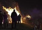 Onlookers enjoying the Lighting of the Bonfires. The Lighting of the Bonfires was pushed up one-day due to inclement weather forecasted for Christmas Eve and the change did not stop large crowds of people and motorists from making the trip to the River Ro Bonfires Burn A Day Earl