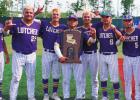 The 2022 Lutcher Bulldog seniors with the coveted State Championship trophy. From left: Noah Detillier, Carter Poché, Eli St. Pierre, Logan Weber, Cohen Veron, Jaryn Darr, Dawson Keller and Jordan Bailey. Photo by Tony Schexnayder Champions!