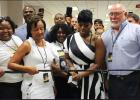 Fantasia joins members of the St. James Parish School Board in cutting the ribbon to the new Performing Arts Academy. From left are West Bank Board Members Raymond Gros, Nicole Charles, Dianne Spencer and Board President George Nassar. Article Image Alt Text