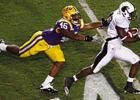Ambrose out running a LSU Tiger defender. Ambrose out running a LSU Tiger defender.