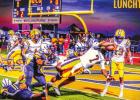 Last Friday was “Lunchtime” for Lutcher quarterback D’Wayne “Lunch” Winfield. Winfield served Lutcher fans their first victory over in-parish rival St. James in four years. Photo by Oliver Hooker “Lunchtime” – Lutcher Quarterback Serves Up Much Needed Victory Over Rival Wildcats