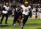 St. James Wildcat quarterback JaJuan Jackson picks up yards during last Friday’s semifinal matchup against the Sterlington Panthers. The Wildcats’ season ended as the Panthers won 63-38. Photo by Oliver Hooker