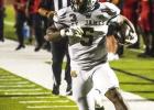 St. James Wildcat running back Kani King-Young scored the Wildcat’s only TD last Friday against Terrebonne. Photo by Oliver Hooker St. James Wildcat running back Kani King-Young scored the Wildcat’s only TD last Friday against Terrebonne. Photo by Oliver Hooker