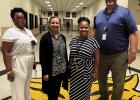 From left: St. James High School associate principal Chakira Gaines-Brown, principal Shawn Oubre, assistant principal Meeka Dennis and assistant principal Brett Smith take a photo in the school’s foyer. Oubre says she owes much of her success to her sta From left: St. James High School associate principal Chakira Gaines-Brown, principal Shawn Oubre, assistant principal Meeka Dennis and assistant principal Brett Smith take a photo in the school’s foyer. Oubre says she owes much of her success to her sta