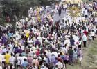 A large crowd participates in the foot procession to bring the 14 ft. Monstrance to St. Michael Church. Organizers estimate more than 2,500 pilgrims came to Convent to be a part of the celebration. Photo by Drew Landry St. Micheal Church Shines As Host Of First Ever Féte Dieu Du Mississippi