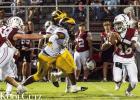 St. James Wildcat senior defenders Myron Jasmin (linebacker) and I’Xavier Anderson (defensive lineman) pressure the Dunham quarterback during last Friday’s 12-7 victory. With the win the Wildcats remained unbeaten (4-0) for the season.