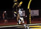 A St. James Wildcat receiver leaps to catch a touchdown pass against West St. John. The Wildcats dominated and shut out the Rams 53-0 to improve to 2-0 on the season. Photo by Oliver Hooker