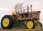 The John Deere tractor above was built in honor of longtime local sugarcane farmer and loyal John Deere customer George “Scrap” Hymel, who passed away last December 30th. Photo by Ashley Tucker Hymel Two Specialty Bonfires Honor St. James Parish’s Longstanding Sugarcane Tradition