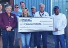 Founder of Pilots for Patients Philip Thomas (third from left) is presented a check for $10,000 by Port of South Louisiana Commissioner and Airport Committee Chairman Joey Murray (right), Airport Director Lisa Braud and Deputy Director Roy Quezaire (2 nd POS LA Held Its First 5K Run
