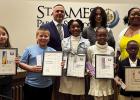 These are the winners of the St. James Parish Bookmark Artwork Contest. From left: Rayne Beck, Harrison Copponex, Superintendent Chris Kimball, Aubrey Jones, Iyohnna Dennis, Lyric Ferry, Juan Harrell and School Board President Nicole Charles.
