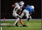 Wildcat sophomore receiver Landon Gravois (#14) shakes off a Ram defender to secure a first down in the 4th quarter of play. Photo by St. James Wildcat junior Aundreas Allen Wildcats Derail Rams In Railroad Classic