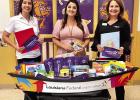 Lauren Rosser of Lutcher High School poses with her pirogue LA FCU Donates School Supplies To Classrooms In St. James Parish