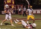 St. James Wildcat senior Montrell Steib (#13) scores a TD in last week’s road game at Dunham. Steib scored both St. James TDs as the Wildcats beat Dunham 12-7. Photo by Oliver Hooker