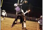 A North Webster and a St. James Wildcat fight for a pass last Friday in the second round playoff game played in North Louisiana. Photo by Oliver Hooker Article Image Alt Text