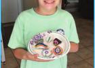 Emma Hotard and a few of her rocks. In This Crazy World, Emma Hotard Finds A Way To Brighten Peoples Day