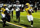 Lutcher Bulldog senior and Kansas State commit Ashton Stark was a workhorse last Friday against St. James as he carried the ball 26 times for 157-yards and four touchdowns. Photo by Tony Schexnayder