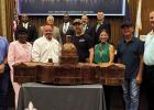 St. James Parish officials unveiled the model of the U. S. Capitol bonfire which will be built on the levee and burned on Christmas Eve, bringing unprecedented attention to St. James Parish during the holiday season. Also pictured are Kenny Berthelot, Tor