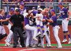 Brock Louque and the Bulldog baseball team celebrate at home plate after Louque hit the Photo by Tony Schexnayder Grand Slam. Champions!