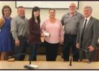 Sharon Kell, representing the St. James Excellence in Education Foundation, presents a $27,864 check to the School District to pay for teacher grants. From left: St. James Parish School Board Vice-President Dianne Spencer, Excellence in Education Board Me Article Image Alt Text