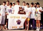 III State Championship trophy. Joan and Tom Murray (far right) started the swim program at Lutcher High in 1995 and one year later they coached the team to the title. The swim program’s success led to the St. James School Board investing and building Lu