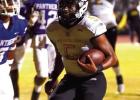 St. James Wildcat QB Brayden Williams on a keeper. Photo by Oliver Hooker Wildcats Scratch and Claw Their Way Back To Beat Woodlawn