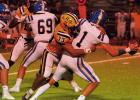 Lutcher Bulldog linebacker Kai Brown sacks the Vandebilt quarterback during last week’s 42-7 victory over Vandebilt. Photo by Tony Schexnayder Bulldog Defense Keeps Speedy Playmakers In Check In 42-7 Win Over Vandebilt