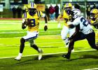 Lutcher Bulldog sophomore quarterback Timmy Charles was dynamic last Friday against St. James. Charles rushed 31 times for 126-yards and a TD. Photo by Tony Schexnayder
