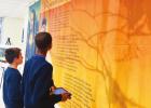 Two eighth grade students study about Leonardo DaVinci using their iPads and the Traveling Art Exhibit which facilitates cross curricular learning at SCC. St. Charles Catholic Is Full Of Thanksgiving