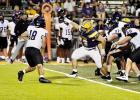 Lutcher Bulldog junior defensive lineman Henry Cox gets through the Hahnville O-line and pressures the quarterback.