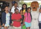 Youth take photos with McGruff. Article Image Alt Text