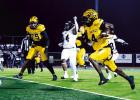 St.James Wildcat senior receiver Kobe Brown ( #4 ) catches a pass from quarterback Brayden Williams and scampers 37-yards for a Wildcat first down. The Wildcats dominated and beat the Many Tigers 40-0 to advance to the semi-finals. Photo by Aundreas Allen Wildcats A Win Away From Shot At Championship