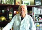 In his Man Cave: Dr. Lamendola spends as much time as he can in his riverside high rise apartment overlooking the Mississippi River. His Man Cave is full of memorabilia and reminders of important and fun times. In the large picture he’s with Steve McQue Article Image Alt Text