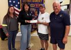 Altalco representatives Happie Ledet and Tiffany Tanner present a $1,000 donation to Lutcher/Gramercy Lions Club president Arthur Murray and treasurer Grant Martin.
