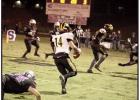 Logan Gravois (#14) picks up yards after a catch. The Wildcats were ousted from the 3A playoffs by North Webster by a score of 26-23. Photo by Oliver Hooker Article Image Alt Text