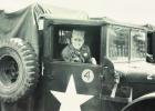 L.J. St. Pierre showing off a smile sitting in a Army Jeep. L.J. St. Pierre showing off a smile sitting in a Army Jeep.