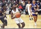 St. James’ Shamar Smith prepares to shoot a layup last Friday against the Lutcher Bulldogs. The Bulldogs, ranked No. 5 in Class 3A, beat the Wildcats 67-47. Photo by Jonrell Jones