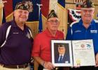Post 5852 Commander Harold Miller (center) accepts an award from National Commander Hal Roesch (far right) and State Commander Robert Lovergne. VFW Receives Early 75th Birthday Present