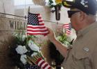 In honor of Memorial Day, VFW Post 5852 member Nelson Rouillier places an American Flag on a grave site of a Veteran buried in St. Joseph Cemetery. The VFW, along with members of the American Legion Post 171 placed roughly 800 flags on the tombstones of l Never Forget Those Who Served And Those Who Gave It All